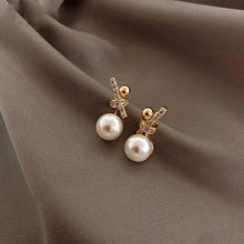 Load image into Gallery viewer, Ladies Gold Plated Sparkling Rhinestones Bowknot Simulated Pearl Stud Earrings
