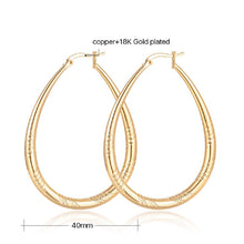 Load image into Gallery viewer, Big Shinning Gold Plated Oval Carved Cut Hoop Earrings