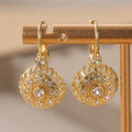Ladies Gold Plated Round Floral Design White Synthetic Zirconia Hook Earrings.