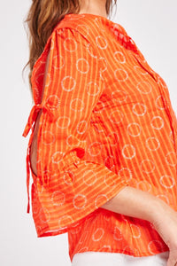 Ladies Orange Circular Print Open Tie Sleeve Cotton Tops