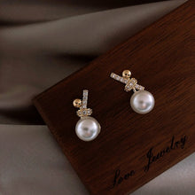 Load image into Gallery viewer, Ladies Gold Plated Sparkling Rhinestones Bowknot Simulated Pearl Stud Earrings

