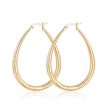 Load image into Gallery viewer, Big Shinning Gold Plated Oval Carved Cut Hoop Earrings
